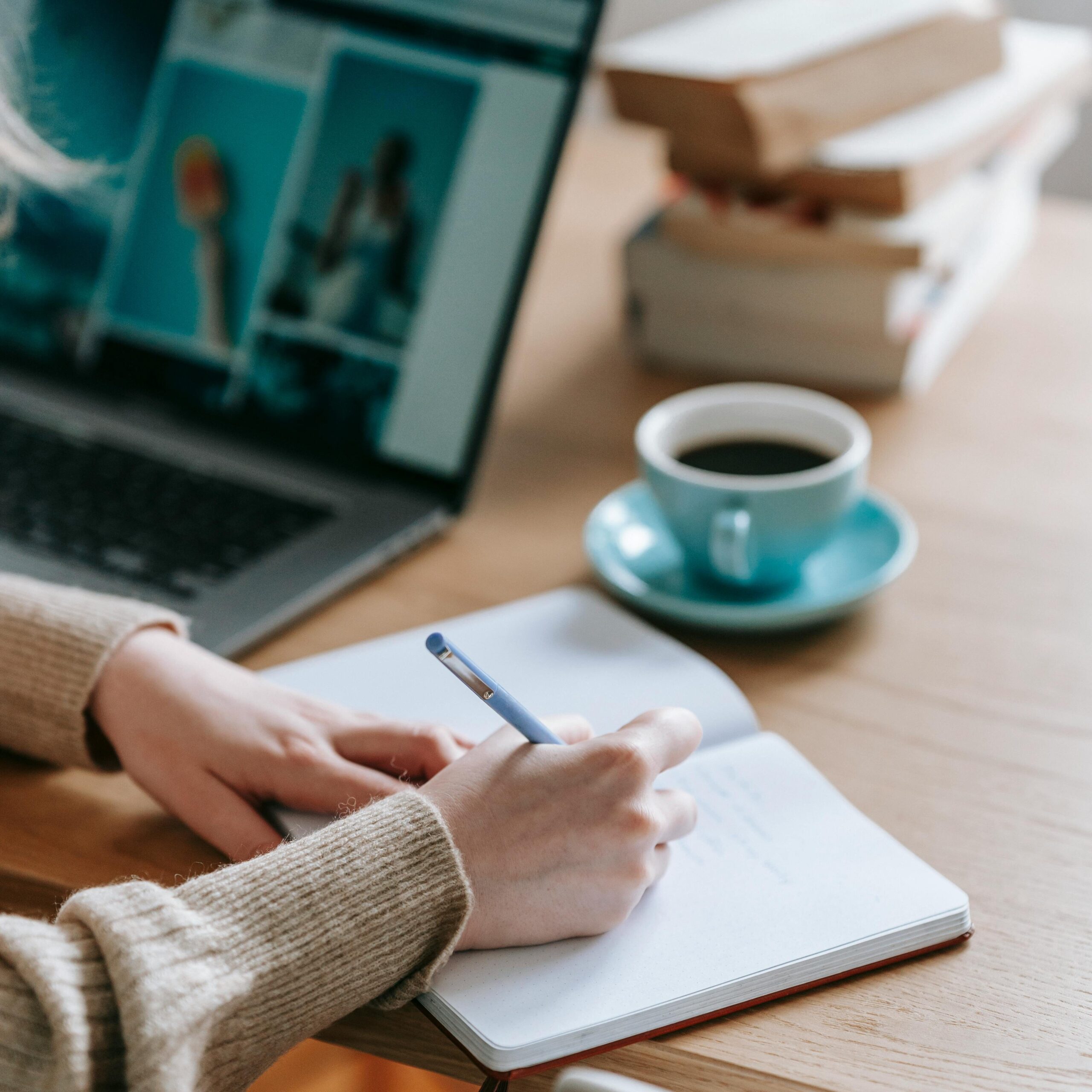 Online Yoga Teacher Training. Student studying with coffee.