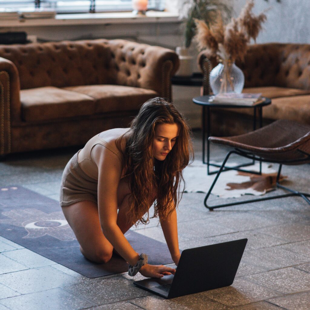 Yoga student starting her online yoga teacher training, embracing personal growth and mindfulness.